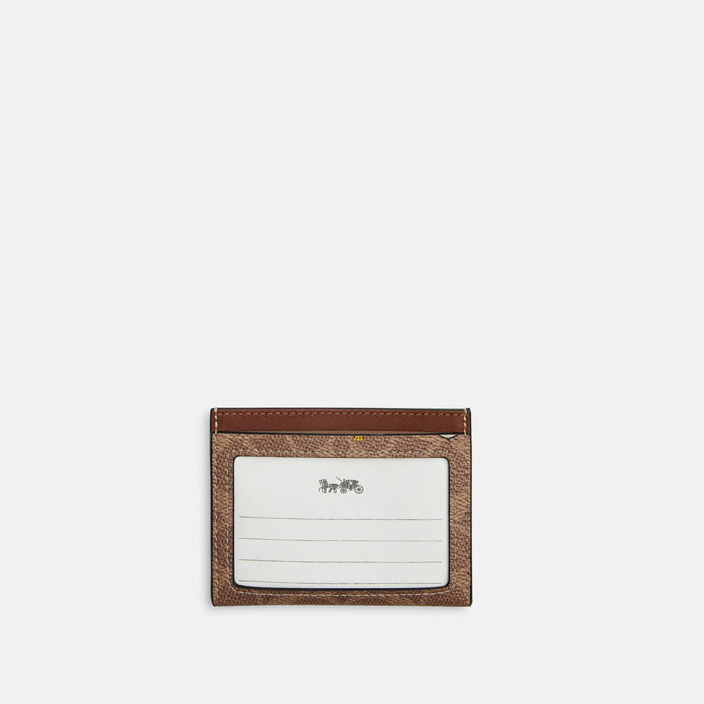 Coach X Peanuts Slim Id Card Case In Signature Canvas With Snoopy Print